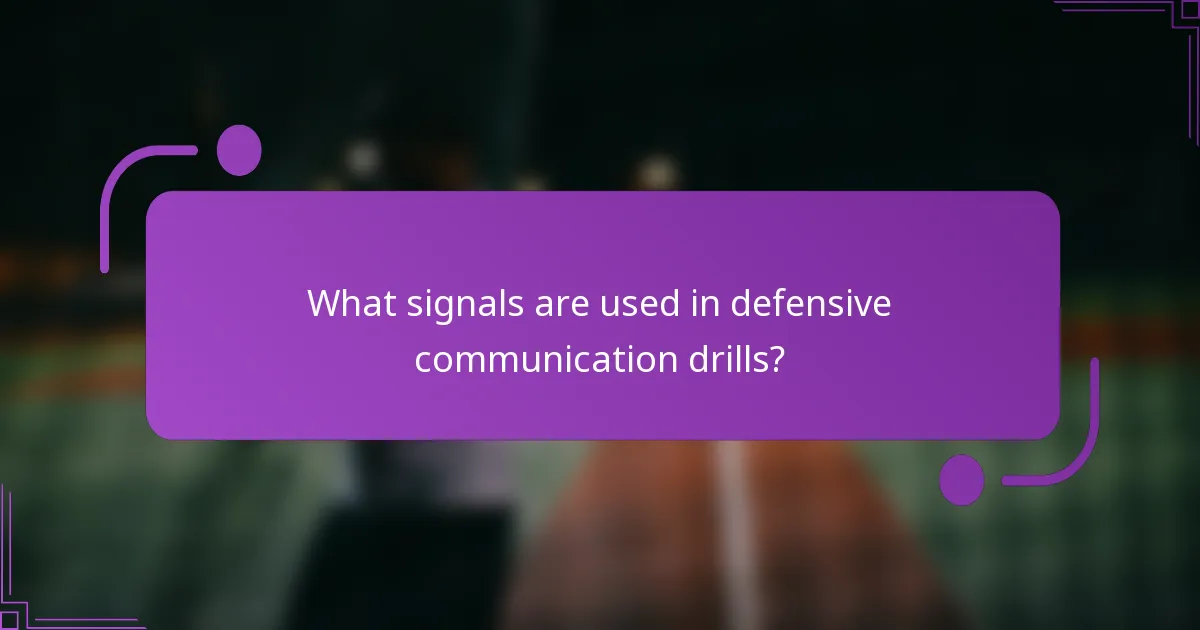 What signals are used in defensive communication drills?